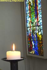 candle and stained glass