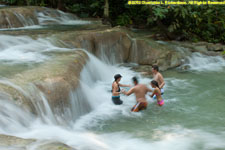 playing in the waterfall