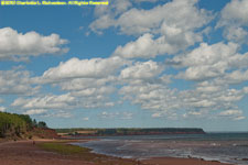 clouds over red shore