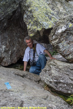 Paul climbing under rock